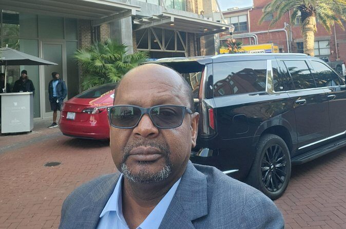 Black SUV Luxury limousines Transportation Services - The Sum Up