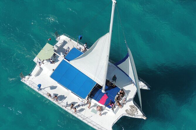 Catamaran to Isla Mujeres Snorkeling, Beach Club and Lunch Tour - Free Time and Optional Activities