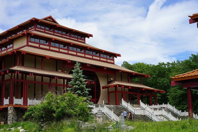 Chuang Yen & Woodbury 1-Day Tour from NYC | Kids 50% Off - An Overview of the Experience: Spiritual Calm and Retail Excitement