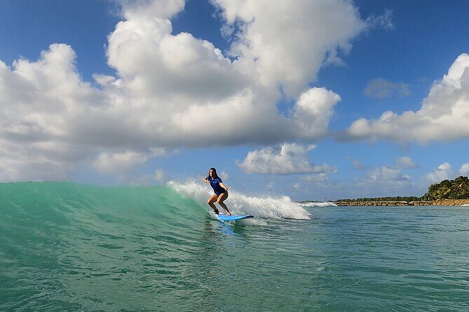 Come and learn to surf at the best surf spots in Guadeloupe. - The Sum Up