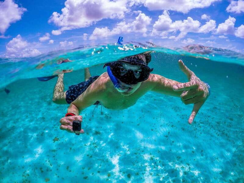 Cozumel: Transparent bottom boat tour and snorkeling activity. - Key Points