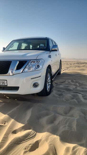 Doha: inland sea Tour With Dune Bashing &Sandboarding fun - Sandboarding: Gliding Down the Dunes