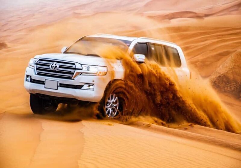Dubai: Desert Safari, Camel Ride, Quad Bike & BBQ Dinner - Camel Rides and Sandboarding: Authentic and Exciting