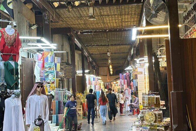 Dubai Old Town Walking Tour with Abra ride, Spice and Gold Souk - The Guide and the Experience