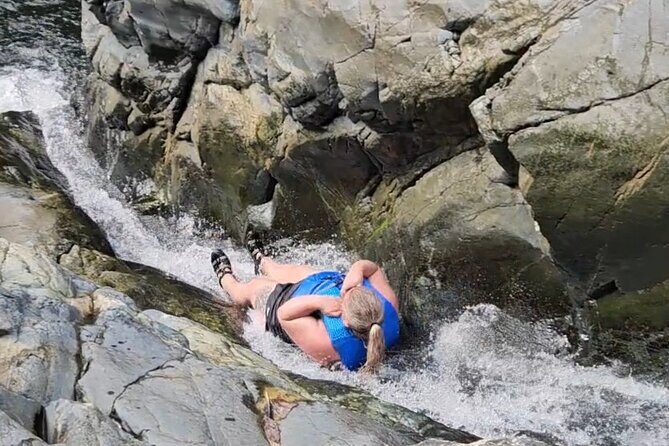 El Yunque Rainforest - Waterslide, Cliff jump, and Rope swing! - Discovering El Yunque: An Adventurous Guide to Puerto Rico’s Tropical Treasure