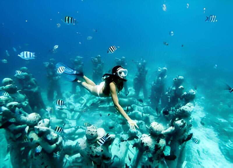 From Cancun: Isla Mujeres by Luxury Catamaran with Drinks - An Authentic Day on the Caribbean with a Touch of Luxury