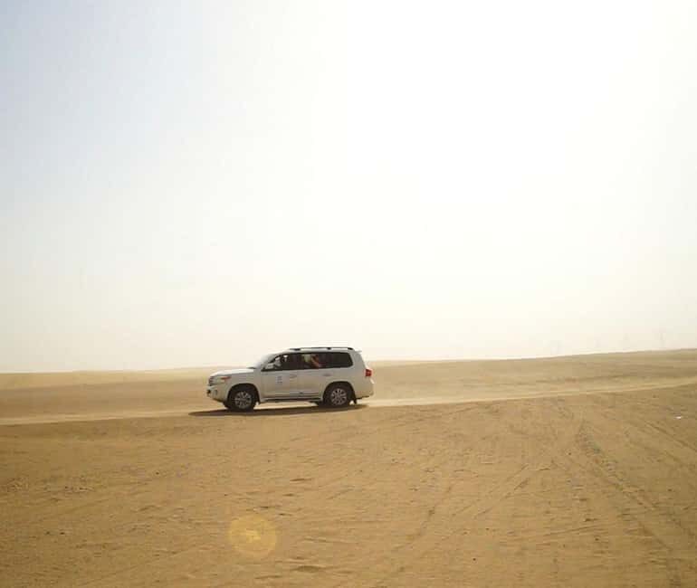 Guided Tour of Qatars Crystal Depths & Singing Sands - Key Points