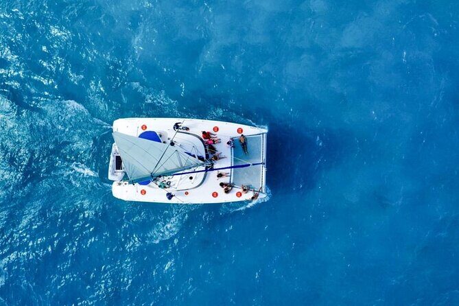 Isla Mujeres: Catamaran Tour with Snorkeling Food, Drinks, Beach - The Return Voyage & Party Atmosphere