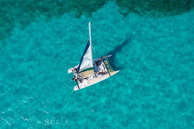 Isla Mujeres Full-Day Catamaran Tour  Buffet, Open Bar & Pickup - Key Points
