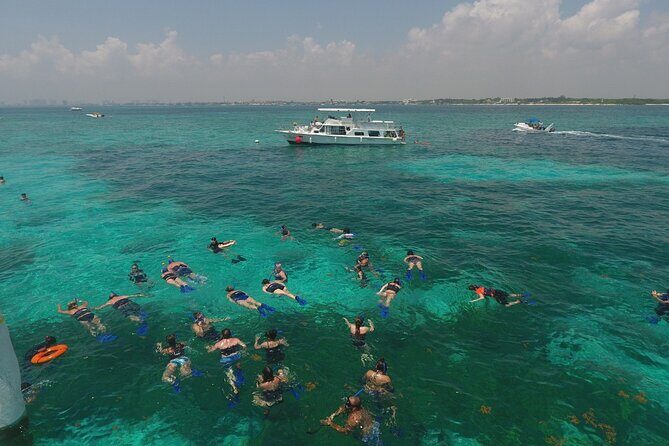 Isla Mujeres Full Day Tour on Yacht with Snorkel and Buffet - The Return & Sunset Celebration