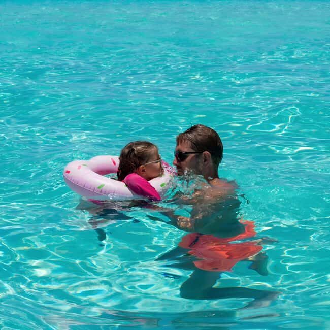 Mnemba Island: Dolphin Swim & Snorkeling with Optional Lunch - The Sum Up