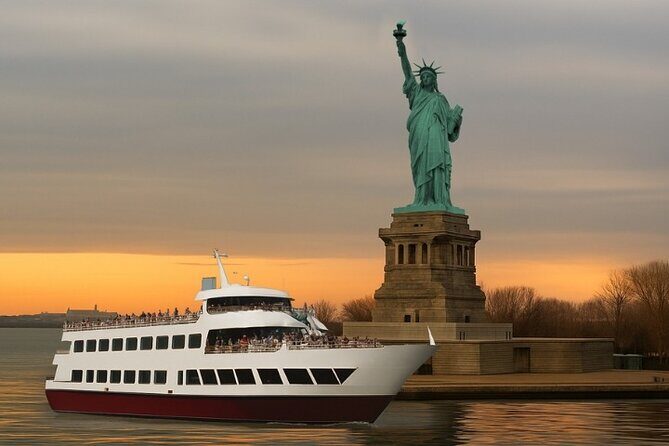 NYC Night Bus Sightseeing Tour with Free Statue of Liberty Cruise - Key Points