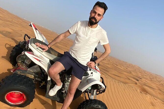 One hour Quad Bike at Red Sand Desert Safari with Camel Ride and BBQ Dinner - A Deep Dive Into the Desert Experience