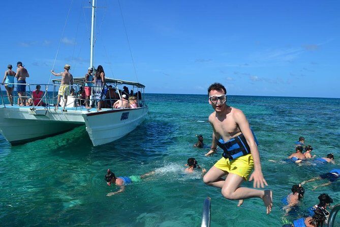 Party boat in Catamaran with Open Bar Only Adults + Snorkeling - Key Points
