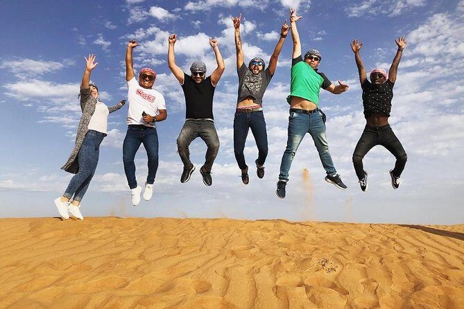 Premium Red dunes safari Camel Safari with bbq dinner live Show's - The Tour Experience: From Dubai to the Dunes
