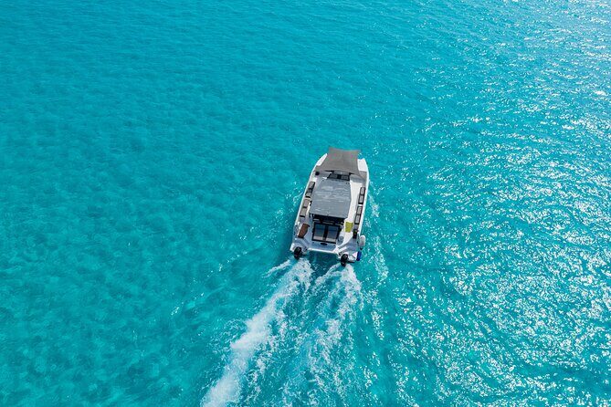 Private Atomic Catamaran Tour to Isla Mujeres - Key Points