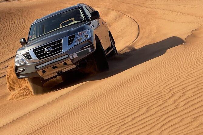 Private Desert Safari with Camel Ride and BBQ dinner in Bedouin Camp - Dune Bashing and Sandboarding