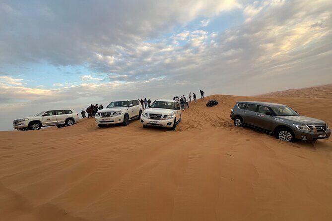 Red Dune Desert Safari Camel Ride, Sandboarding with BBQ Dinner - Key Points