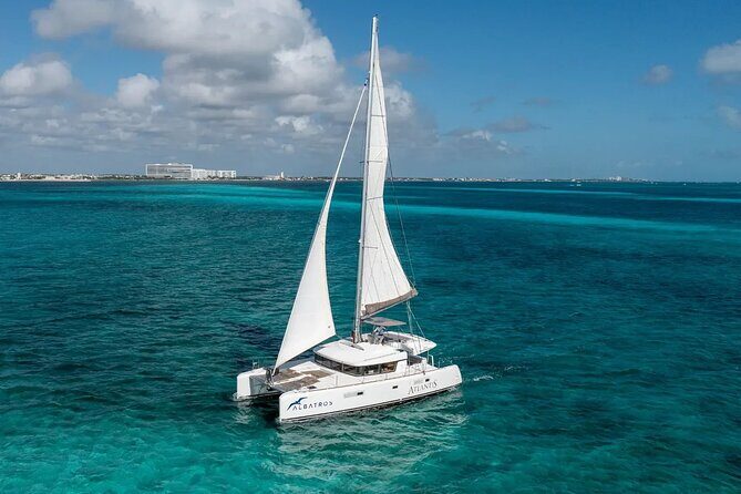 Sail to Paradise Catamaran Tour with Snorkel and Beach Club - Key Points