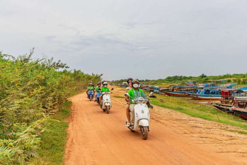 Siem Reap: Floating Village Sunset Boat Guided Vespa Tour - The Sum Up