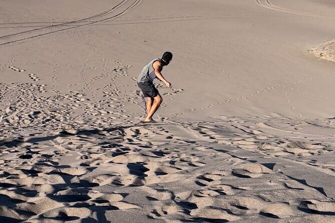 Slide into the sunset by Sandboarding in Las Dunas Del Mogote - Discovering Las Dunas Del Mogote: An Authentic Baja Experience