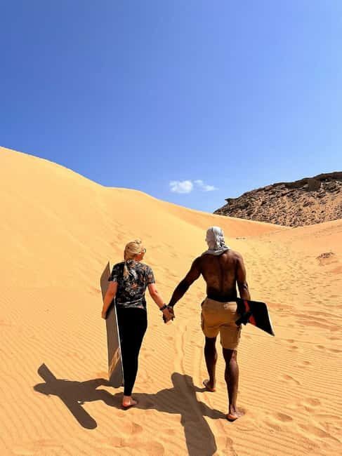 Sunset Desert Camel Ride with Sandboarding and BBQ Dinner - What is Included and Why It Matters