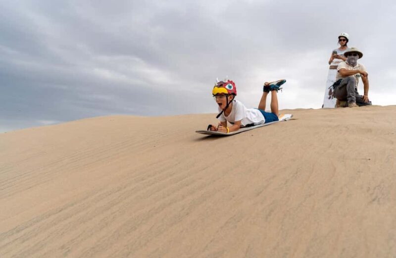 Sunset Desert Camel Ride with Sandboarding and BBQ Dinner - The Sum Up