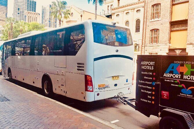 Sydney Airport to Sydney CBD shared ride seat in vehicle shuttle transfer - The Experience at the Airport