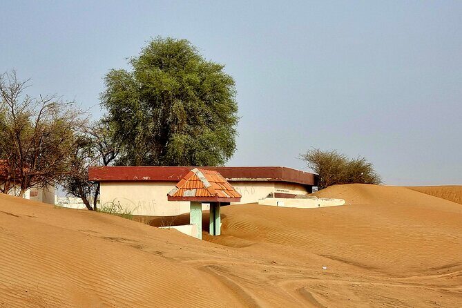 The Ghost Village Safari Tour with Dune Bashing and Sandboarding - The Sum Up