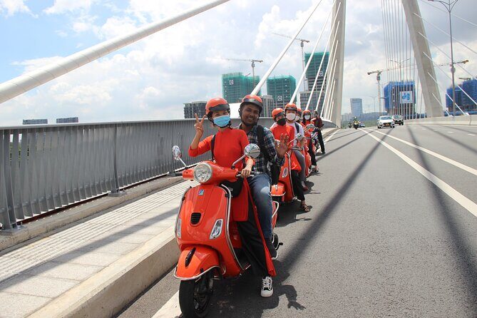 The Insider's Saigon With Female Ao Dai Riders Vespa 4,5 Hours - Exploring the Heart of Ho Chi Minh City on Vespa