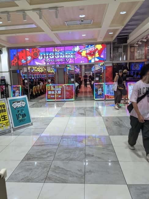 Tokyo Shinjuku : Private Walking Night Tour with Pachinko - Authenticity and Family-Friendliness