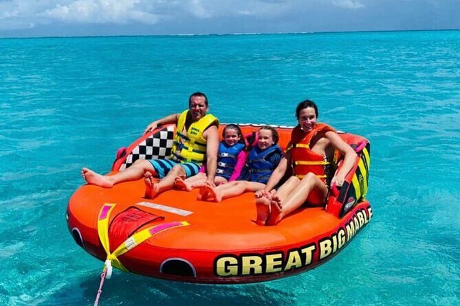 Tubing on grace bay beach Turks and caicos islands - The Sum Up