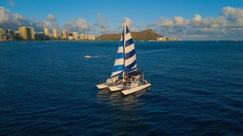 Waikiki: Sunset Swim & Sailing Experience - Key Points