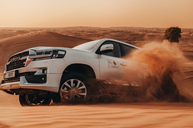 Deluxe Sunset Desert Safari: SandSurfing, Camel Ride & BBQ dinner - Key Points